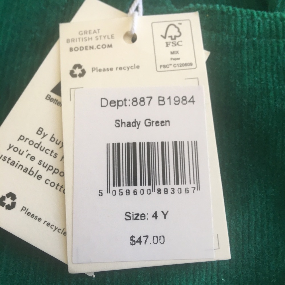 Green and red plaid vest with green corduroy pants.